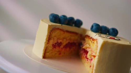 Cake Slice with Blueberries on a White Plate