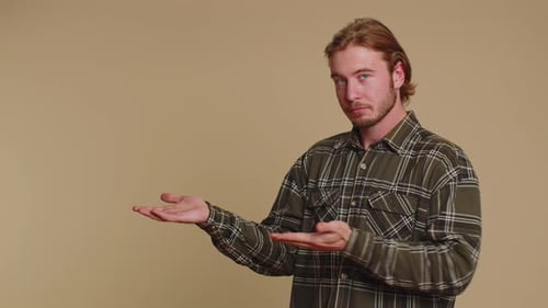 Man Pointing Empty Place Advertising Area for Commercial Text Copy Space for Goods Promotion