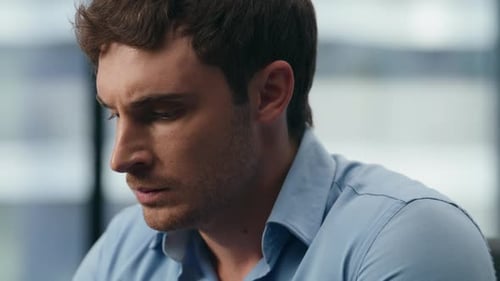 Serious Director Looking Graphics Laptop Screen in Office Interior. Nervous Manager Typing