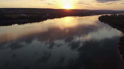 Aerial Drone Flight of Summer Sunset Reflecting on the Lake Waterscenic Footage of Nature