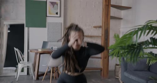 Young Woman Doing Cardio Workout at Home