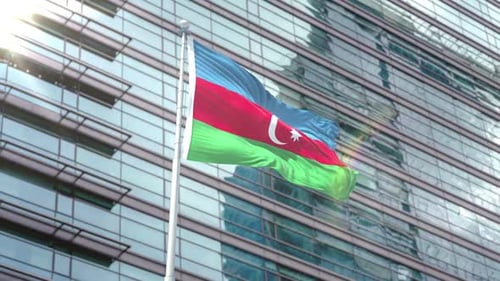 Realistic Azerbaijan Flag Waving Against Modern Corporate Building