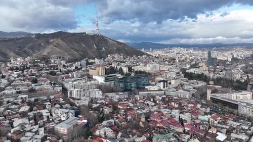 Aerial view of Tbilisi city central park and Bridge of Peace. Beautiful cityscape of old Tbilisi
