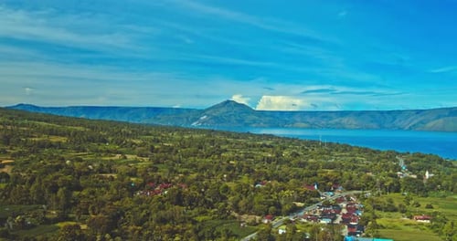 panorama of lake toba with mountain background