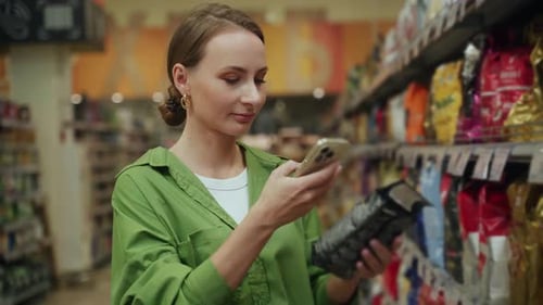 Woman Scans Food Package with Smart Phone