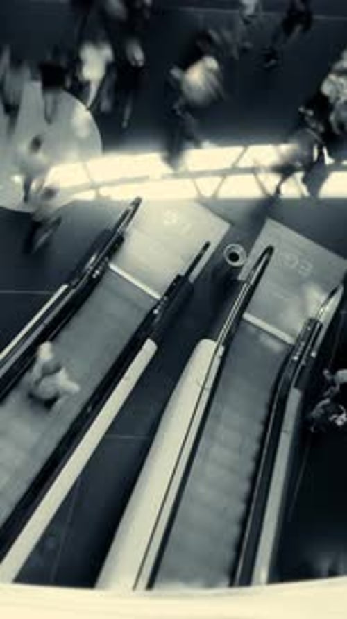 Dynamic Urban Escalators A Captivating View of Vibrant Daily Activities in the City