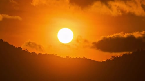 Golden Sunset Over Hill Silhouette with Moving Clouds