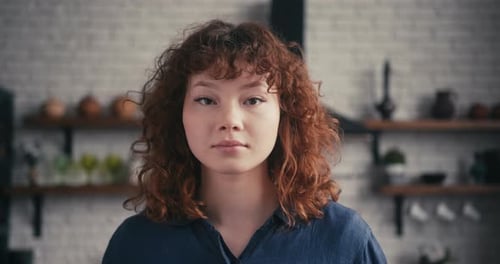 Young Woman Smiling Portrait in Kitchen