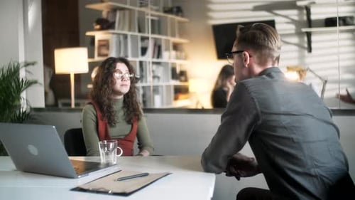 Business Meeting and Handshake in a Modern Office