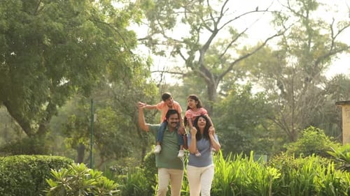 Indian Parents And Kids Having Fun In The Park