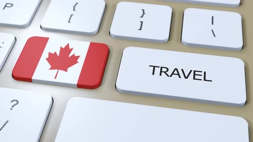 Finger Pressing Canada Travel Button on Computer Keyboard