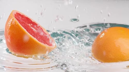 Juicy Grapefruit Splashing in Water
