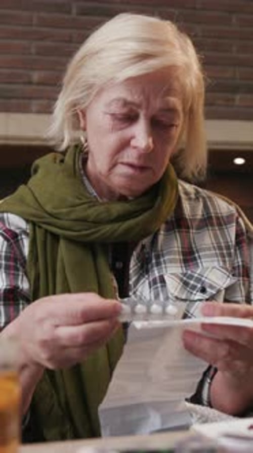 A Woman Deeply Absorbed in Reading a Heartfelt Letter with Emotion in a Cozy Inviting Setting