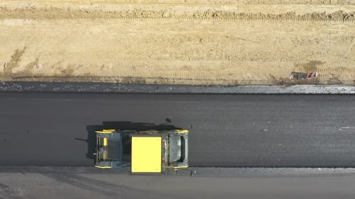 Aerial Shot of Roller Laying New Asphalt Layer