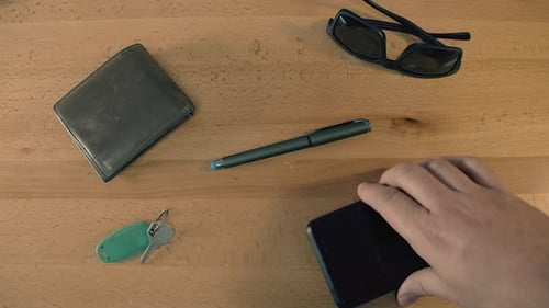 Everyday Essentials Arranged on a Wooden Table