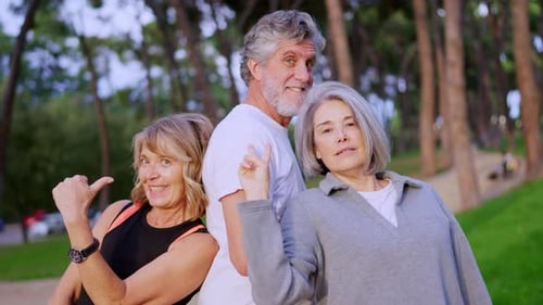 Playful Senior Friends Joking and Having Fun Together Outdoors