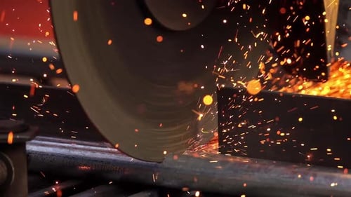 Saw Cuts Metal Bar Producing Shower of Sparks