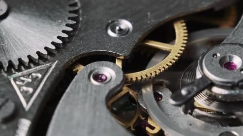 Macro shot of watch gears spinning together