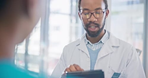 Medical Professional Explains Information to Patient