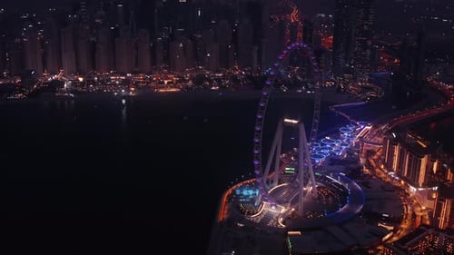 Aerial night view of the biggest ferris wheel in the world - Ain Dubai