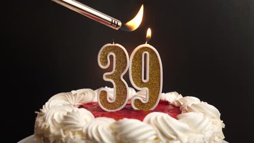 Lighting Number 39 Candles on Birthday Cake