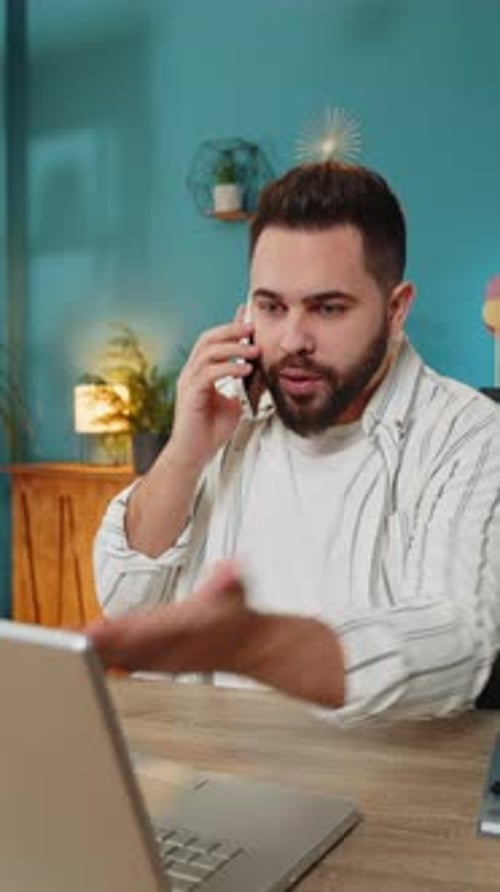 Furious Annoyed Angry Businessman Freelancer Engage in Heated Phone Quarrel Conversations at Office
