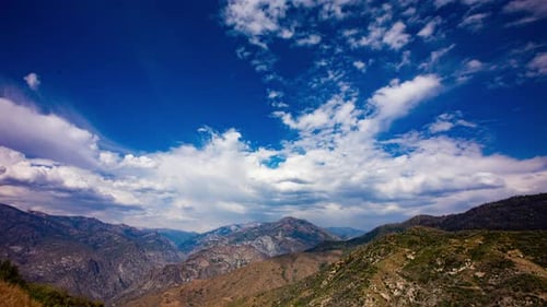 Time Lapse - Beautiful cloudscape moving over mountain rage and the valley