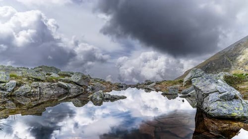 Mountain Landscape With Small Lake With Cloud Movement