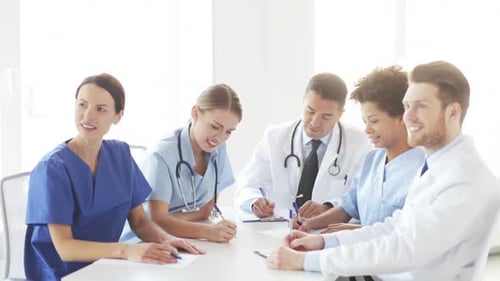 Happy multiethnic doctors meeting at hospital conference in the United States