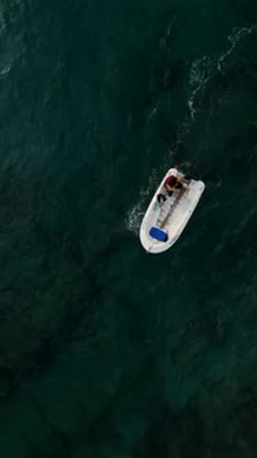 Serenity at Sea Vertical Video of a Sailboat Gliding Through Calm Waters