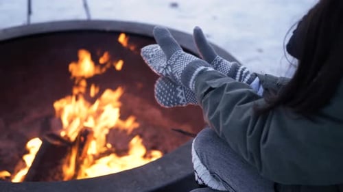 Warming Hands by Winter Fire Pit
