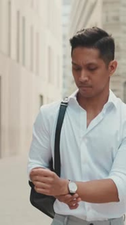 Young businessman walking through the business district