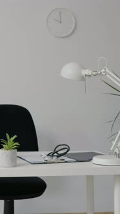 Clean Doctor's Office with Stethoscope on Desk
