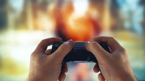 Hands Play Video Game on Controller, Close Up