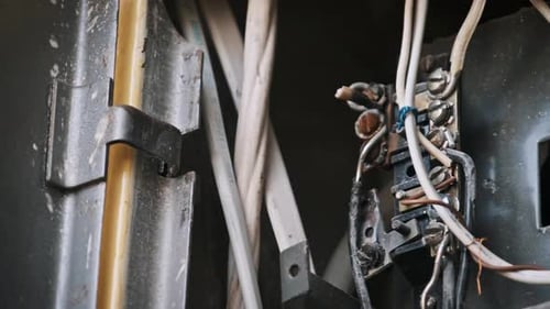 Electrical Connections Closeup of Terminal Strip Wiring Inside Grey Cabinet