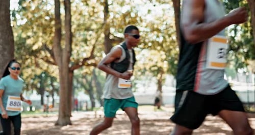 Marathon Runners Racing Through Park and Urban Area