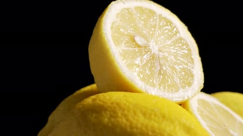 Macro shot of lemons against a black background
