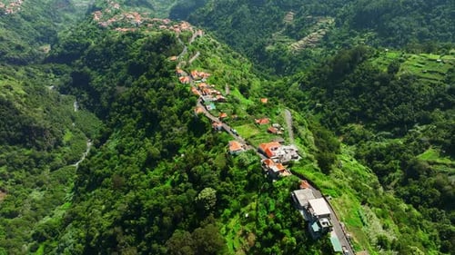 Small Town Surrounded By Dense Green Forest High in the Mountains Village with Beautiful Old Houses