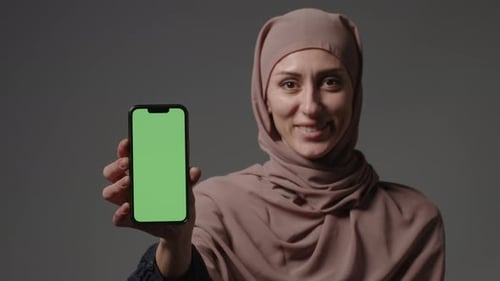 Portrait Smiling Arabian Lebanese Girl Muslim Islamic Woman in Hijab Hold Smartphone in Front Show