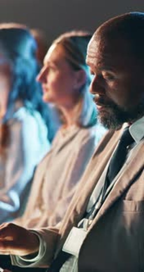 Adults Sitting at Corporate Event Indoors