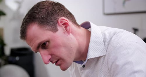 Man Concentrating in a Workplace Environment