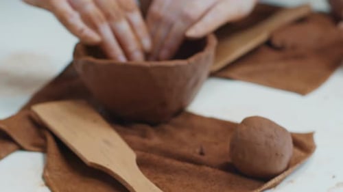 Person Works with the Clay in the Pottery Workshop During Masterclass