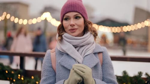 Winter in City Portrait of Beautiful Adulr Woman Against Ice Rink and Decorations Happy Christmas