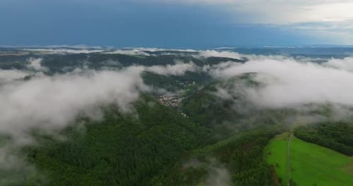 Low Clouds Covering Part of the Landscape Heavy Clouds Green Vegetation Mist Fog and White Clouds in