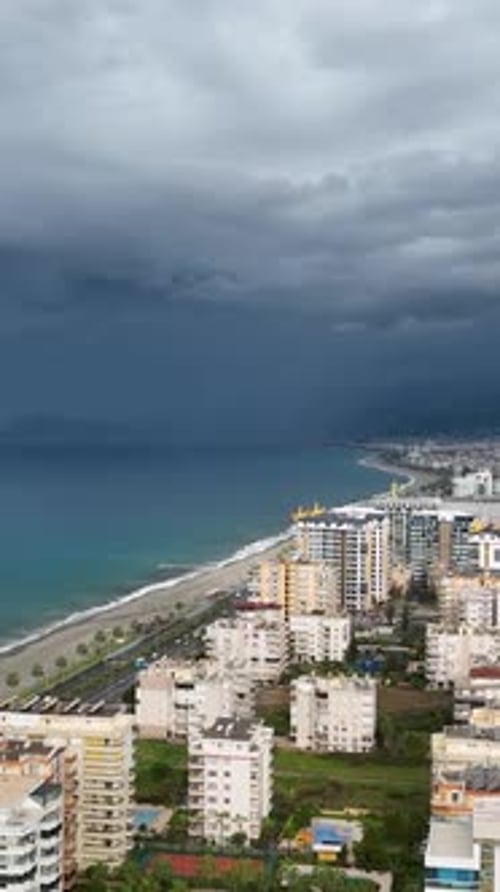Vertical Video Coastal Tempest Aerial View of Stormy Mediterranean Coastline and City Panorama