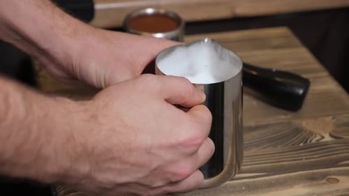 The Process of Making Cappuccino or Latte in a Coffee Shop