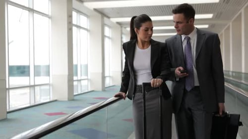 Business People at Airport Travel on Moving Walkway 25-30