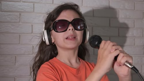 Energetic Girl Singing Passionately into Microphone