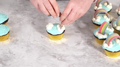 Decorating Chocolate Cupcakes with Buttercream Frosting and Rainbow Candy