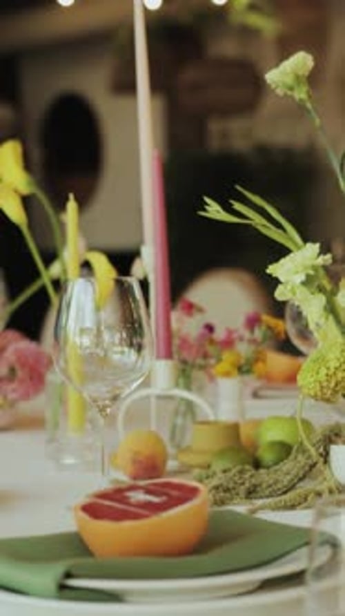 Elegant Table Setting with Grapefruit and Flowers